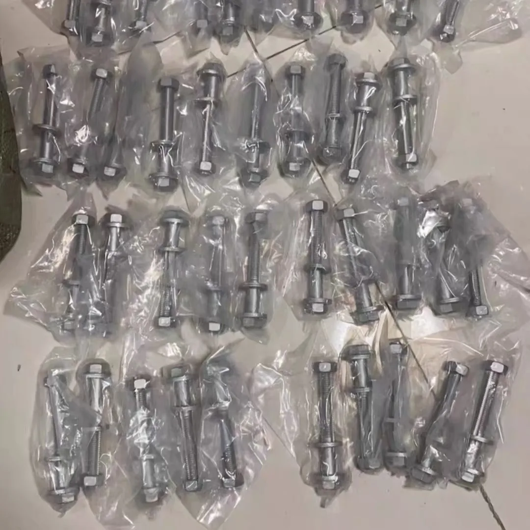 Camber bolt kits bagged one kit per bag, a batch of several dozen laid out before labelling