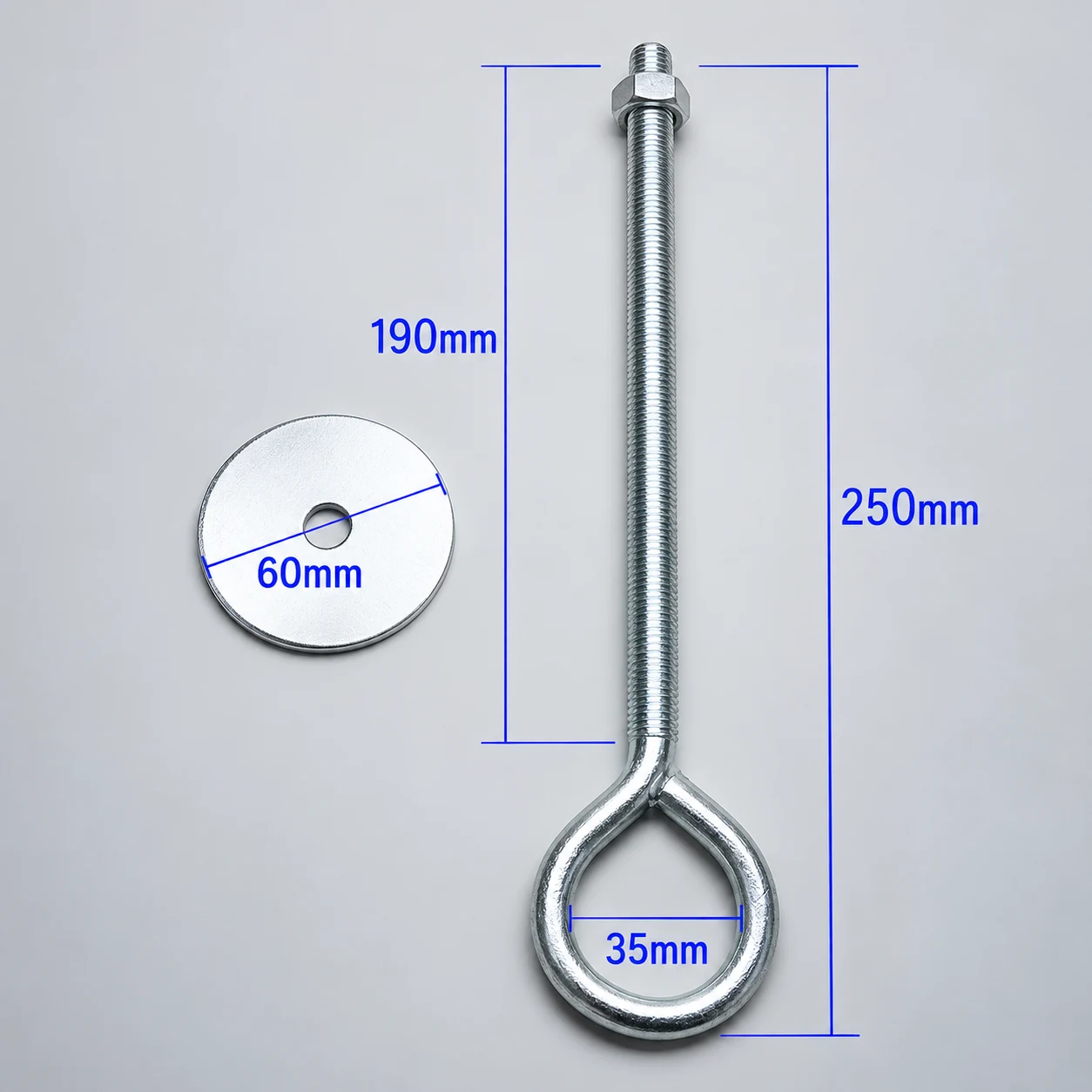 Boulon à œil zingué à œil plié dans du rond, 250 mm hors tout avec une tige filetée de 190 mm et un œil de 35 mm, posé à côté de son écrou six pans et d'une rondelle de 60 mm, cotes indiquées