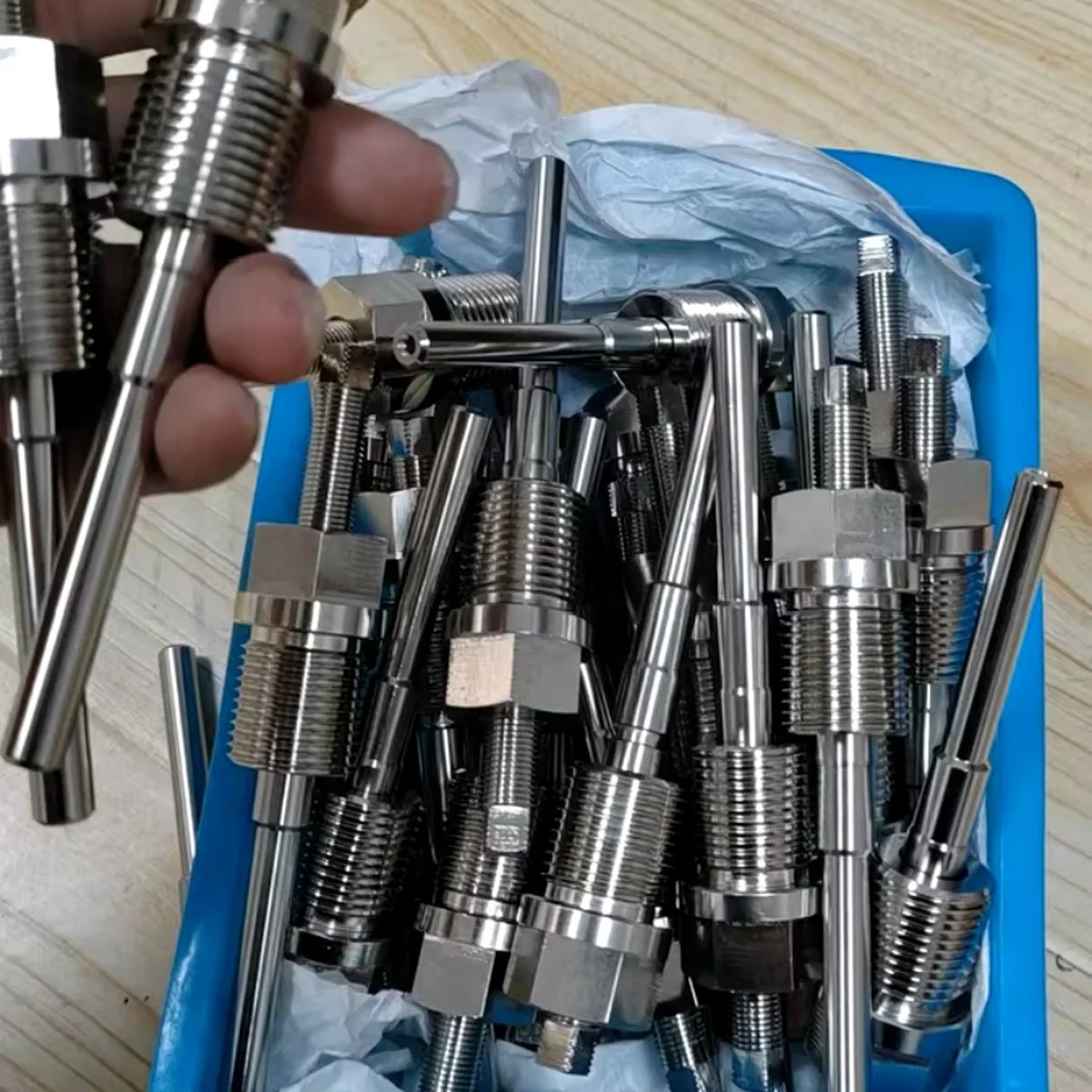 Tray of CNC-turned stainless steel sensor fittings produced as an identical batch by EKINSUN