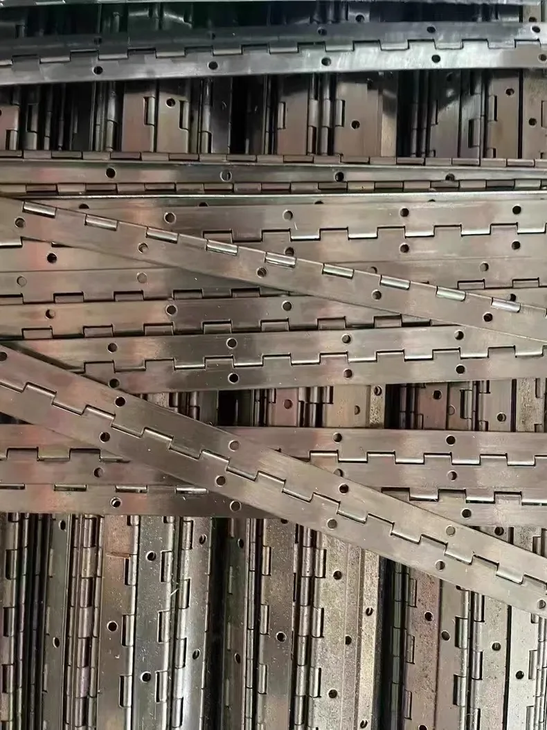 A batch of continuous (piano) hinges stacked in the workshop