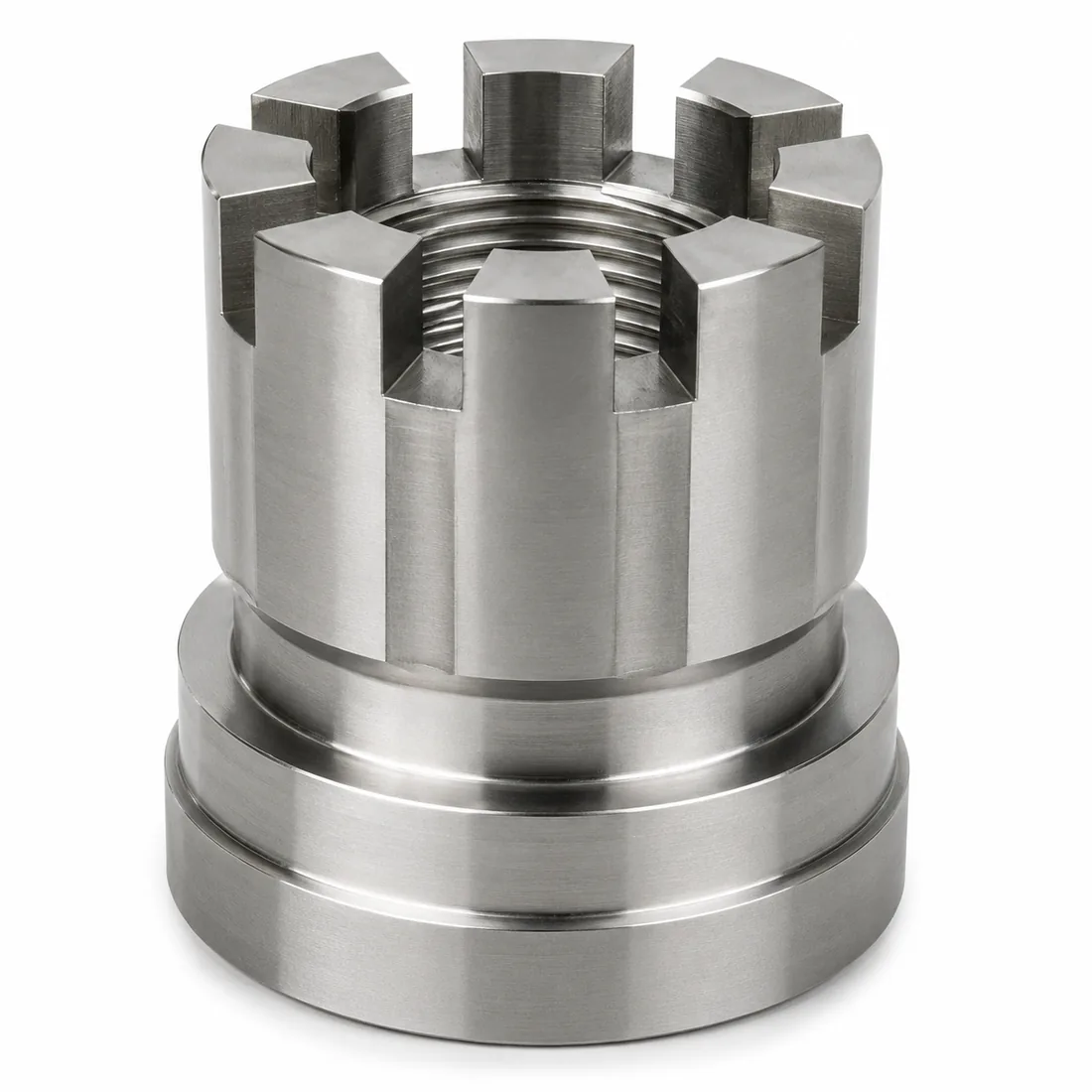 Custom stainless steel castle nut with flanged stepped base machined by EKINSUN