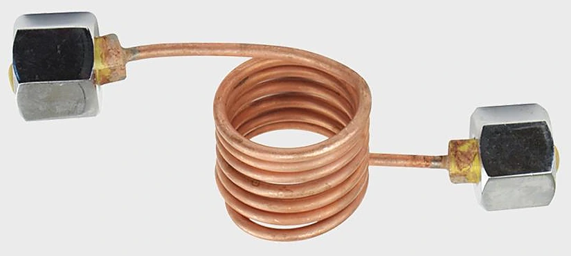 Copper pigtail coiled in the middle with a hex cylinder nut at each end, used between a gas cylinder and a manifold or regulator