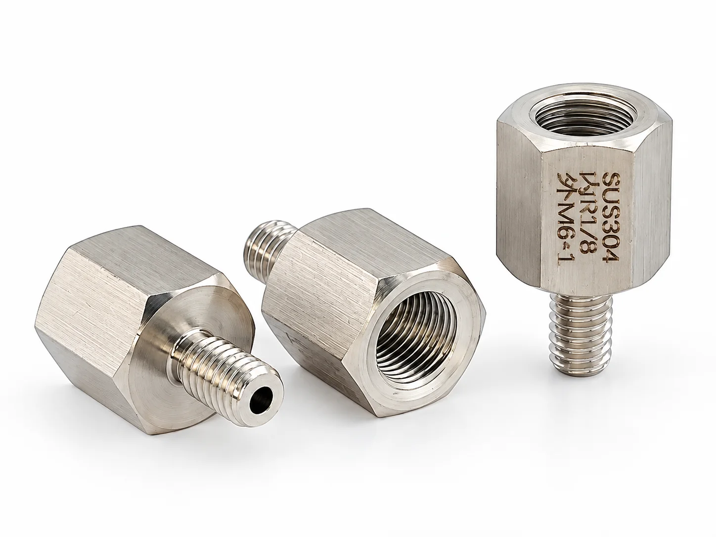 Three 304 stainless hex adapters with an Rc 1/8 female thread in the hex and an M6x1 male thread, marked SUS304
