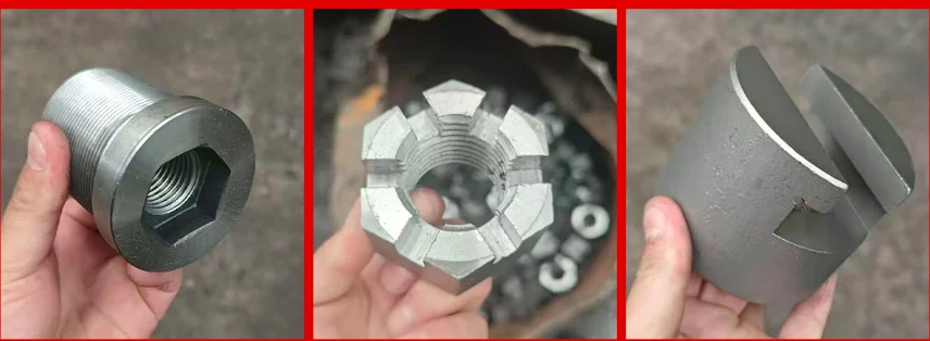 A tall machined hex nut with an internal hex drive, a large slotted castle nut and a slotted collar, held in the hand
