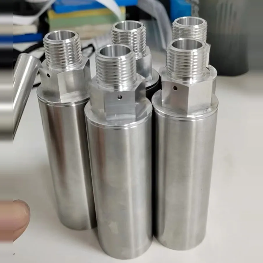 Four cylindrical sensor housings machined from bar, each with a hex, a male thread on top and a small cross hole in the hex