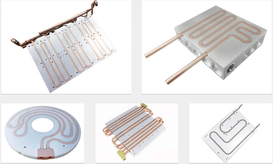 Cold plates built with continuous copper tube pressed into milled grooves in aluminium plates — serpentine, circular and multi-pass layouts with the tube ends brought out as the connections