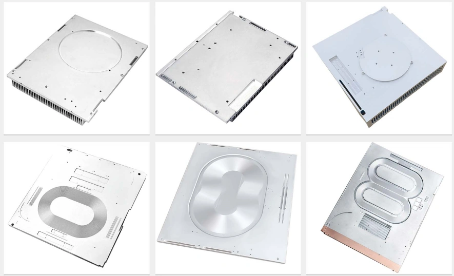 Large machined heat sink baseplates with fin stacks along one edge, recessed device pockets, internal liquid channels and a copper spreader layer on the underside of one plate