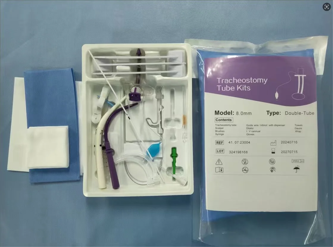 Real tracheostomy tube kit, 8.0mm double-tube — sterile tray with cuffed tube, nitinol guidewire, dilator, syringe, scalpel, drapes and gauze beside the labeled sterile pouch