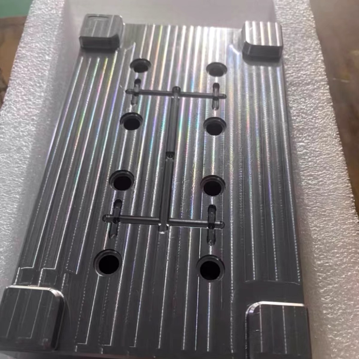 Anodized aluminum plate packed on foam insert to protect surface finish — EKINSUN packaging